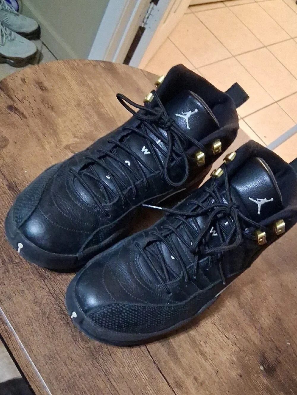 Jordan Men's High-Top Sneakers in Black with Gold Accents